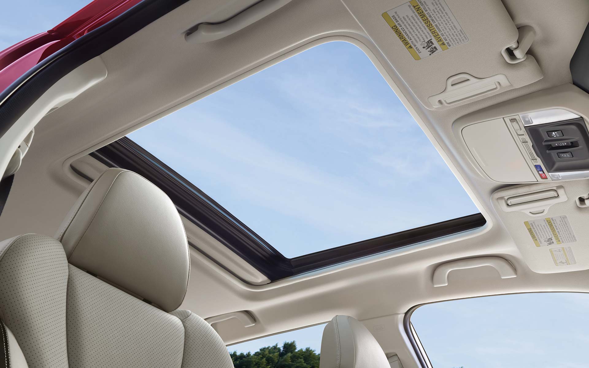 A view through the power sliding panoramic moonroof on the 2022 Forester Sport.